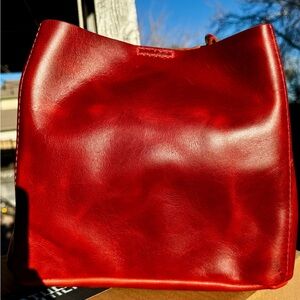 Butterfly Crossbody by Portland Leather Goods (pictured outside)